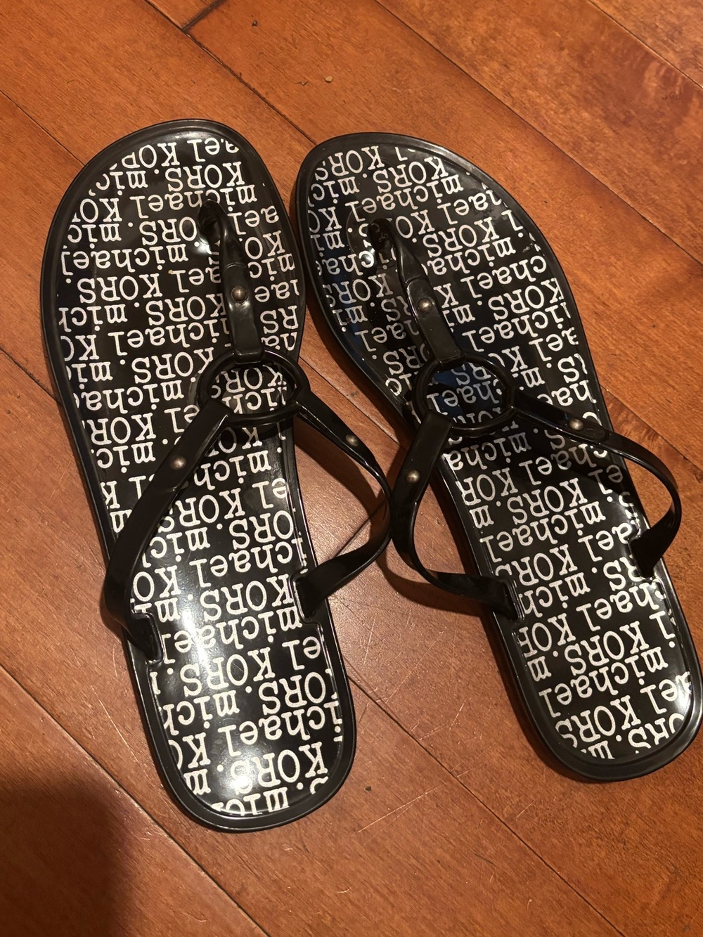Michael Kors Black Logo Jelly Thong Sandals with Circular Emblem